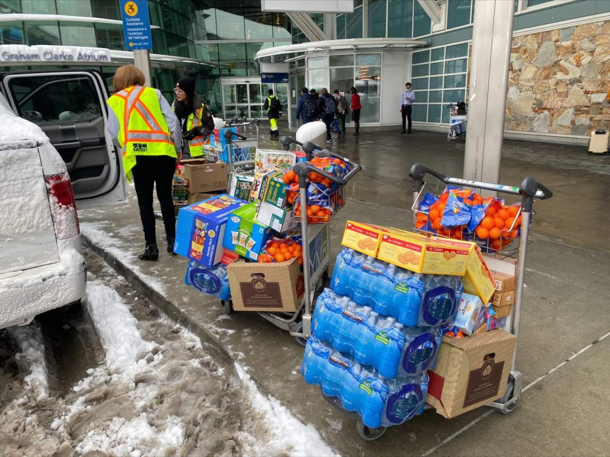 Vancouver airport staff making Costco grocery runs to give food and water to people waiting inside the terminal.