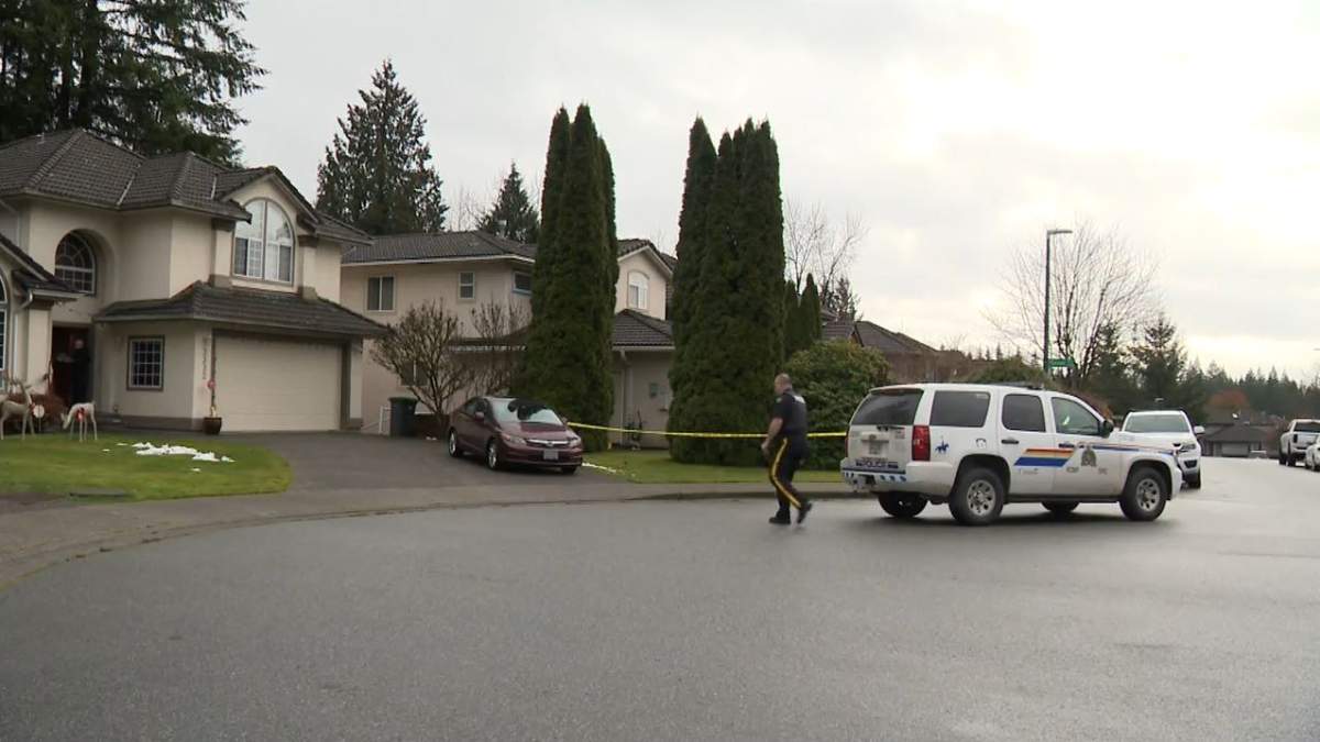 Police were seen Friday morning at a home in Coquitlam investigating a fatal shooting.