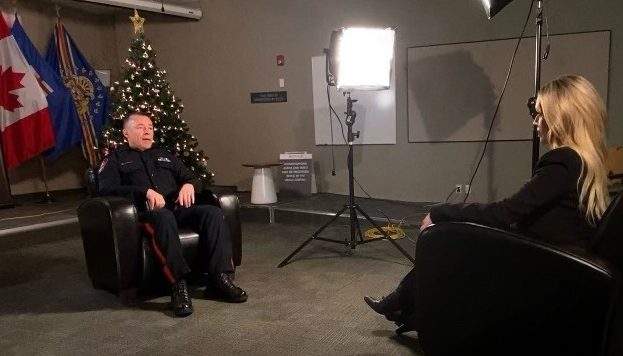 Calgary Police Chief Mark Neufeld with Global Calgary Anchor Dallas Flexhaug.