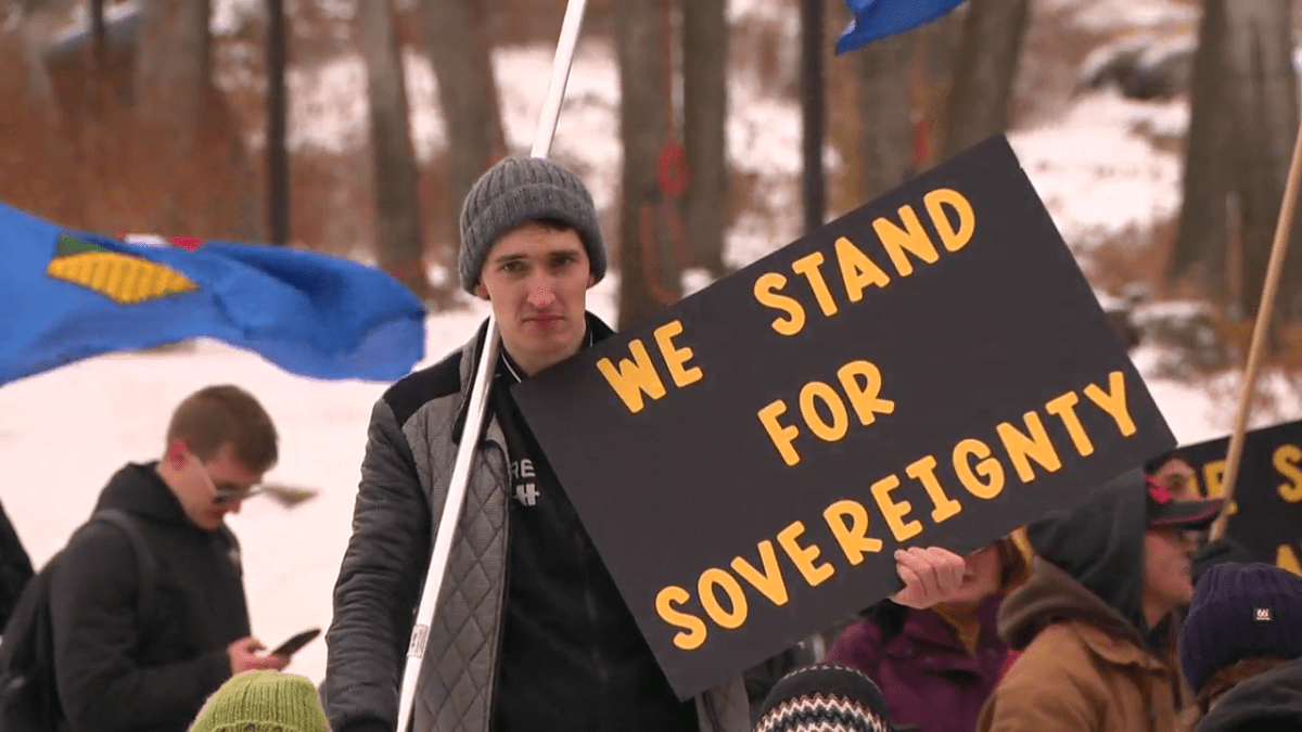 Protest member outside the Alberta legislture, Dec. 4, 2022.