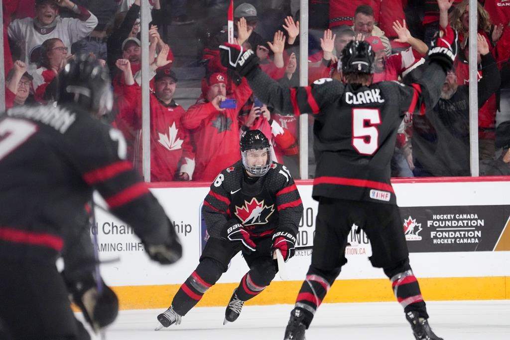 Canada’s Connor Bedard, centre, reacts after scoring the game-winning goal in overtime of IIHF World Junior Hockey Championship quarterfinal action against Slovakia in Halifax, Monday, Jan. 2, 2023. THE CANADIAN PRESS/Darren Calabrese