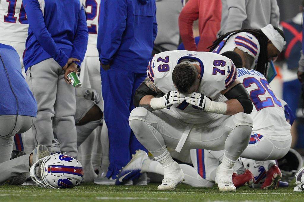 Buffalo Bills’ Spencer Brown (79) reacts as teammate Damar Hamlin is examined during the first half of an NFL football game against the Cincinnati Bengals on Jan. 2 in Cincinnati.
