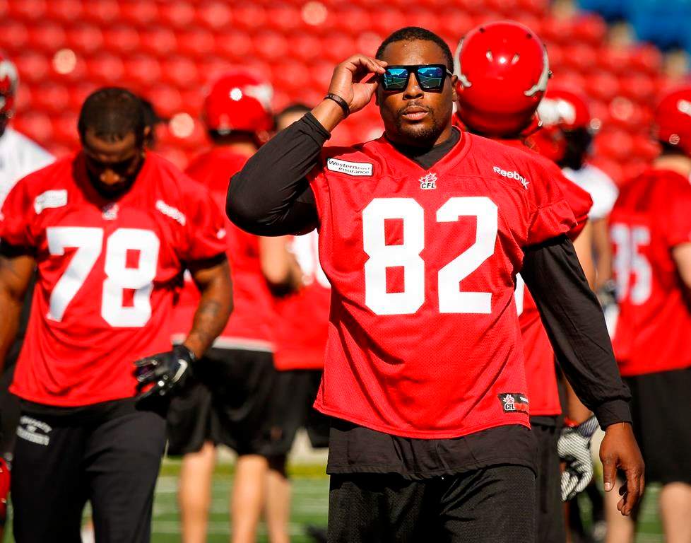 Calgary Stampeders' Nik Lewis, walks off the field during the first day of training camp in Calgary on June 1, 2014.