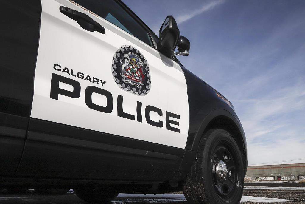 Police vehicles at Calgary Police Service headquarters on Thursday, April 9, 2020. A Calgary man is in life-threatening condition after a pedestrian collision in the city's northwest on Wednesday, police said.  THE CANADIAN PRESS/Jeff McIntosh.