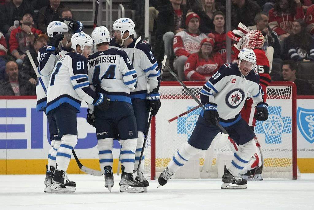 Winnipeg Jets defenseman Nate Schmidt (88) celebrates his goal against the Detroit Red Wing in the second period of an NHL hockey game Tuesday, Jan. 10, 2023, in Detroit.