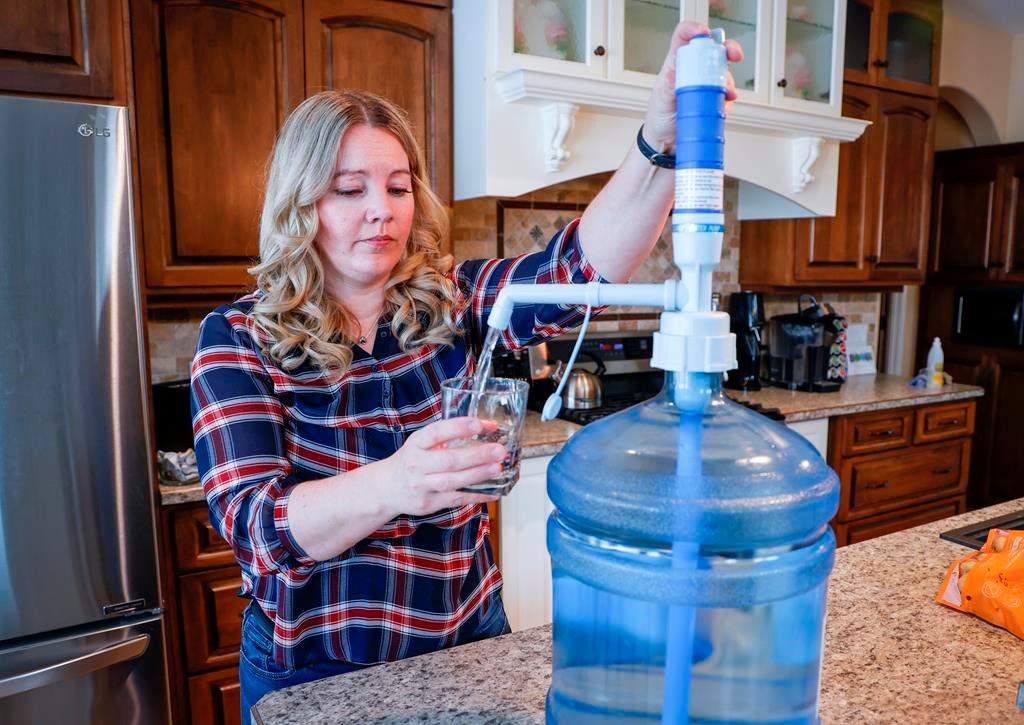 Jody Young and her family are having to use bottled water after their well became so contaminated by lead it's no longer drinkable, near Red Deer, Alta., Wednesday, Jan. 11, 2023.