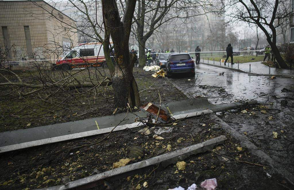 A helicopter blade on the ground at the scene where a helicopter crashed on civil infrastructure in Brovary, on the outskirts of Kyiv, Ukraine, Wednesday, Jan. 18, 2023.
