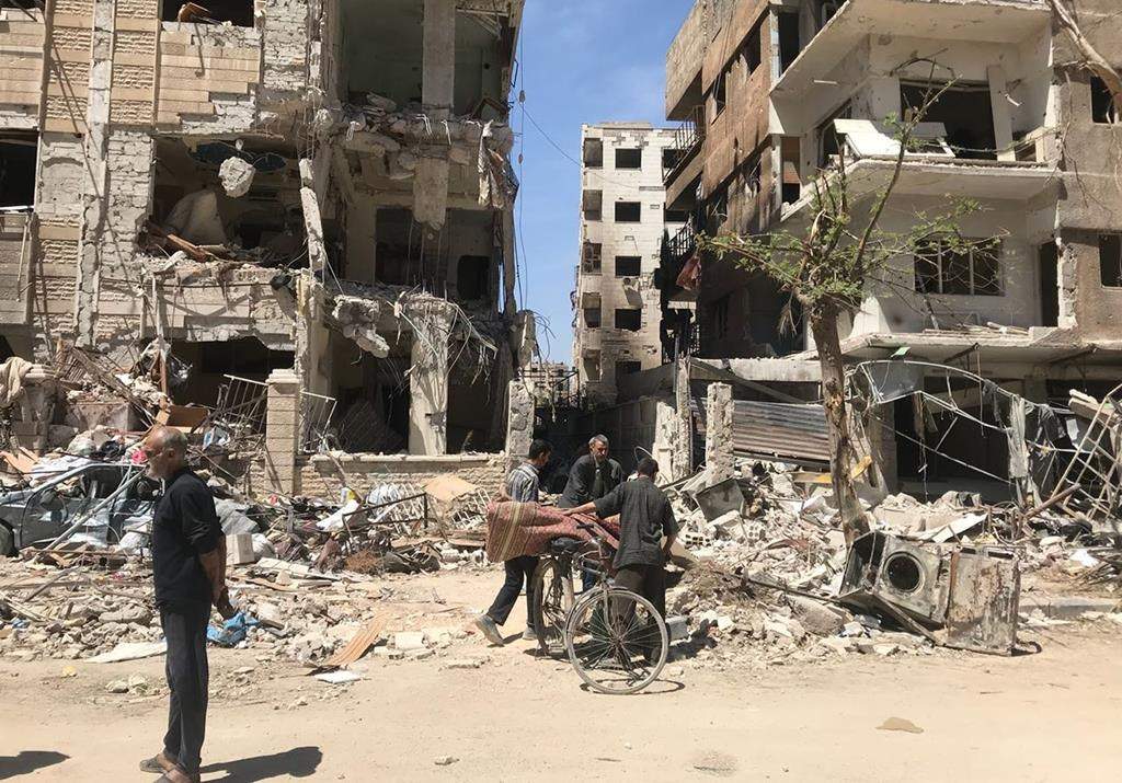 Damaged buildings in Douma, Syria, site of a suspected chemical weapons attack on April 16, 2018. (AP Photo/Hassan Ammar, File)