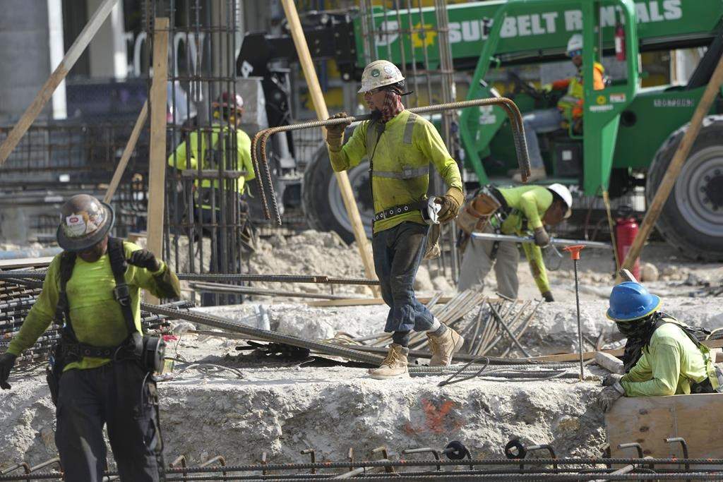 People work at a construction site. AP Photo/Lynne Sladky.