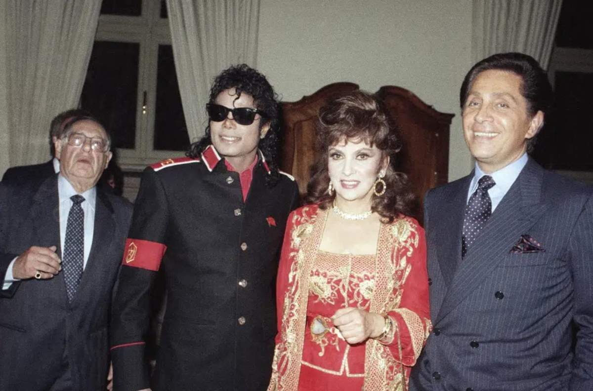 U.S. pop superstar Michael Jackson poses with Italian actress Gina Lollobrigida and fashion designer Valentino.