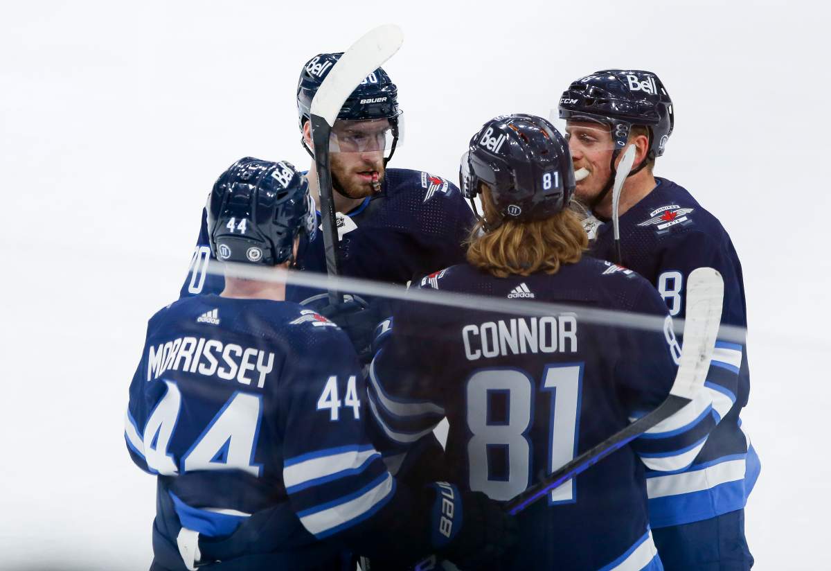 Winnipeg Jets’ Josh Morrissey (44), Pierre-Luc Dubois (80), Kyle Connor (81) and Nate Schmidt (88) celebrate Dubois’ goal against Tampa Bay Lightning during first-period NHL action in Winnipeg, Friday, Jan. 6, 2023.