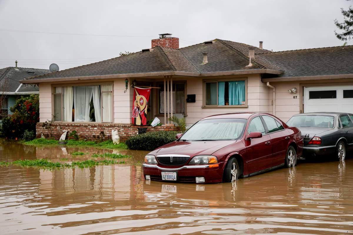 Flooding from huge amounts of rain is seen in a neighborhood off of Holohan Road near Watsonville, Calif., on Monday, Jan. 9, 2023.