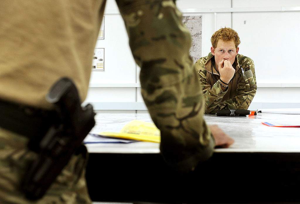 This picture taken on October 31, 2012 shows Britain's Prince Harry at a mission briefing at the British controlled flight-line at Camp Bastion in Afghanistan's Helmand Province, where he was serving as an Apache helicopter pilot/gunner with 662 Sqd Army Air Corps.