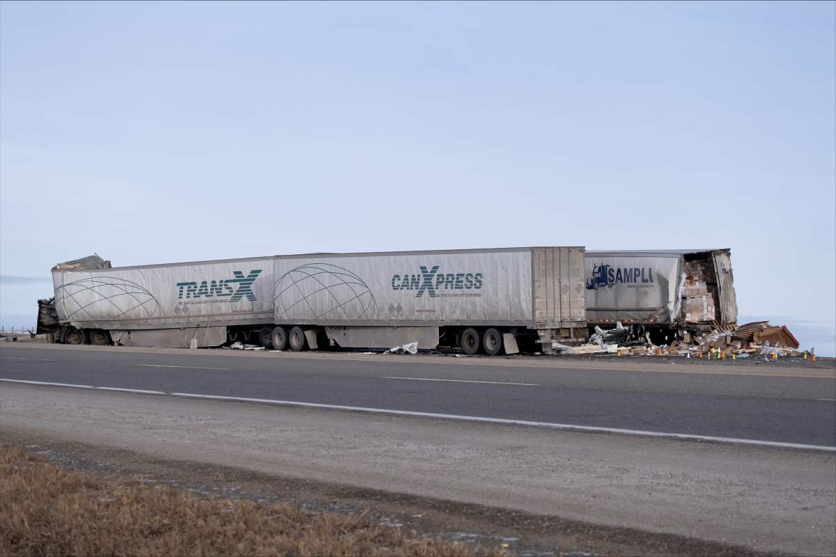 The side of part of the wreckage from a fatal crash on Highway 1 near Paradise Road, north of Chestermere on Jan. 20, 2023.