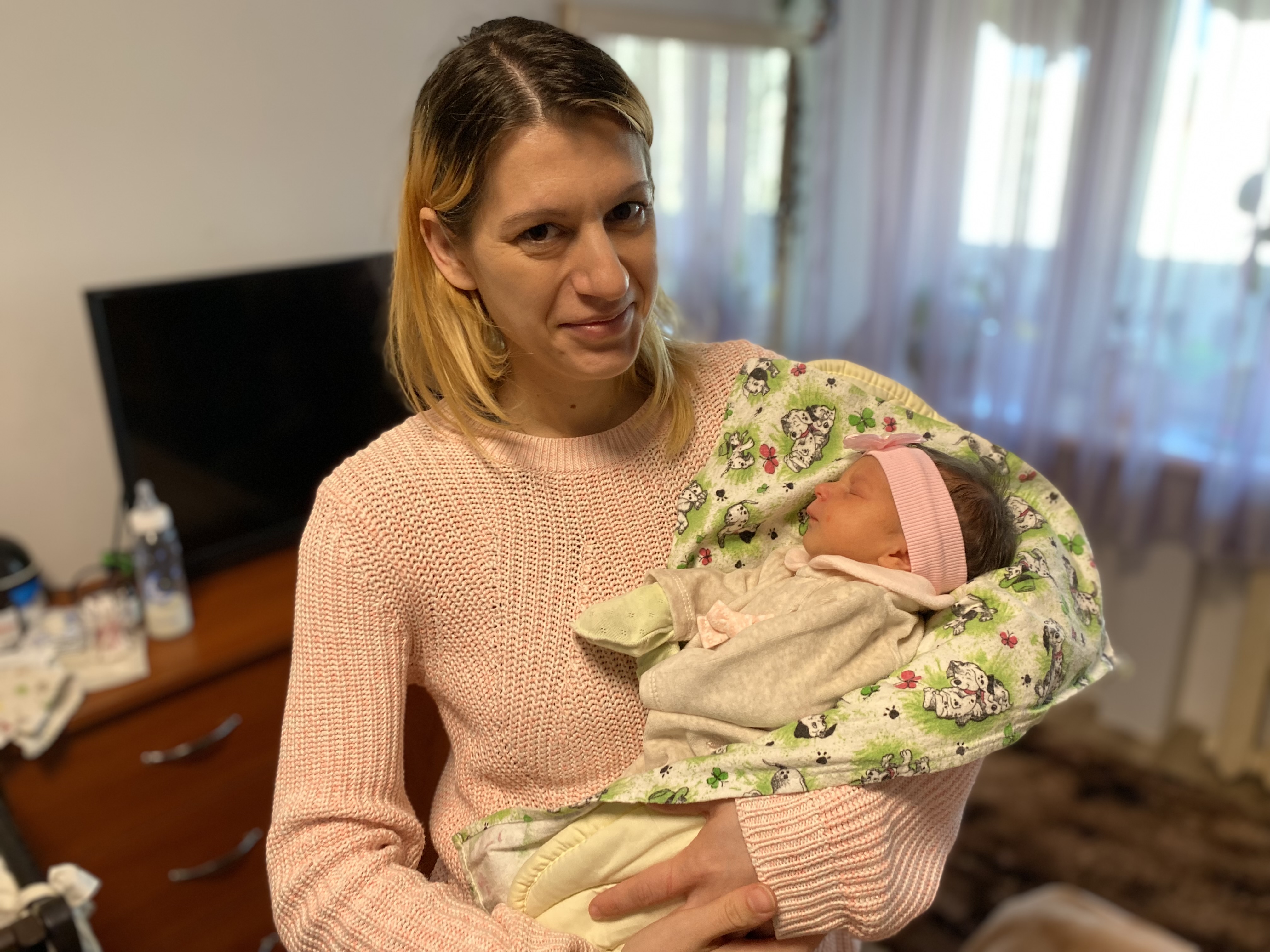 Yevheniia Mulika holds baby Polina, who survived a Russian rocket attack on the Kherson Maternity Hospital, Ukraine.
