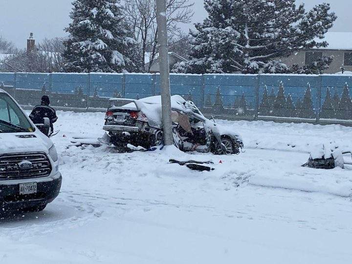 Police on the scene of a crash in Brampton, after a car collided with a pole in the early hours of Jan. 29, 2023.