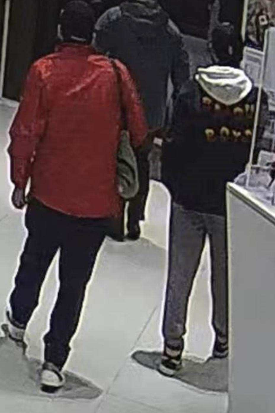 Police in Port Hope, Ont., say these two men are suspects after a car was reported stolen from a dealership on Jan. 5, 2023.