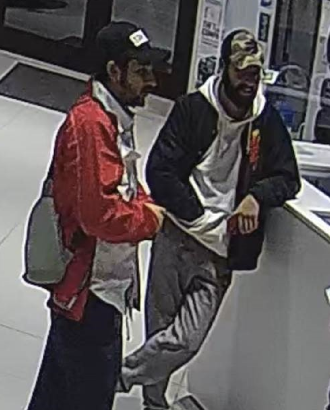 Police in Port Hope, Ont., say these two men are suspects after a car was reported stolen from a dealership on Jan. 5, 2023.