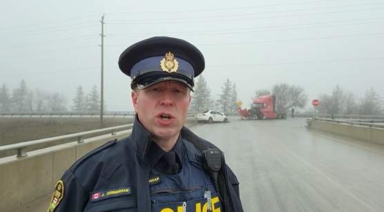 OPP const. Josh Cunningham at scene of crash in Puslinch.