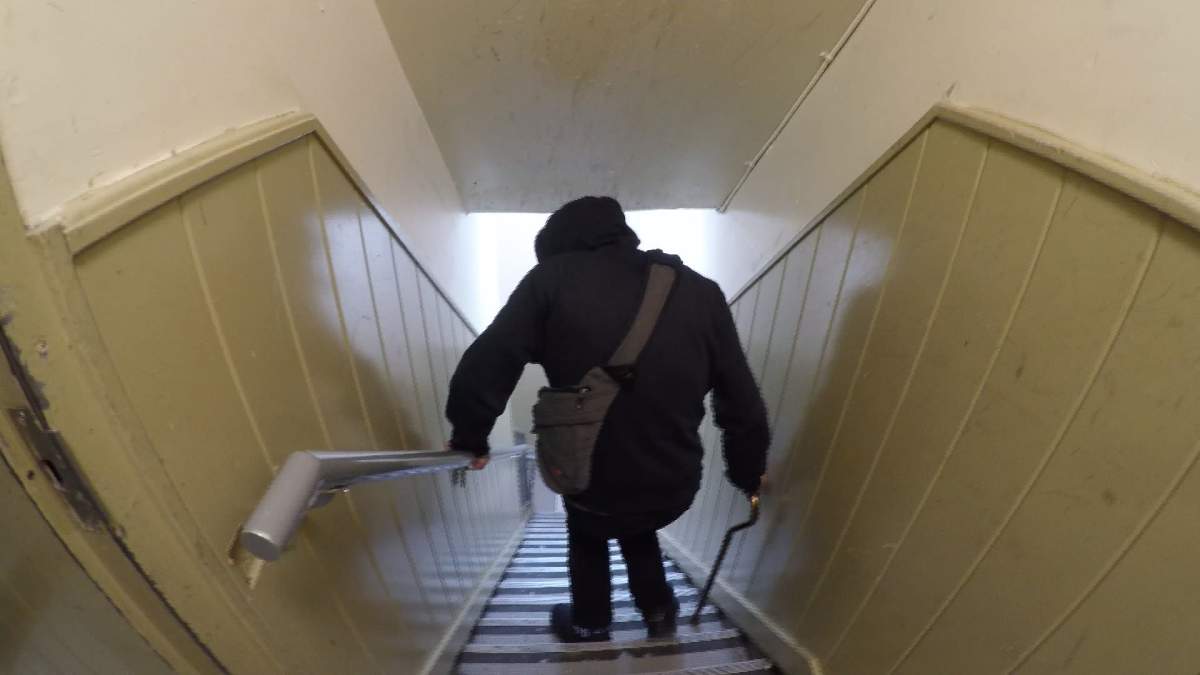 Justin Brown trying to navigate the stairs in the St. Helen's Hotel.