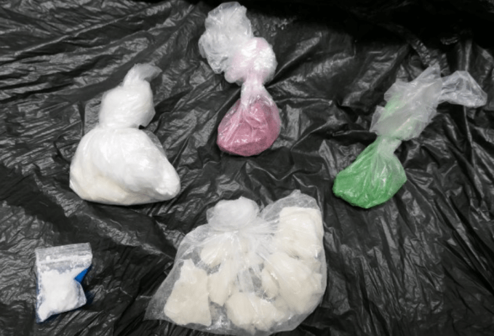 Officers also seized drugs, police allege.