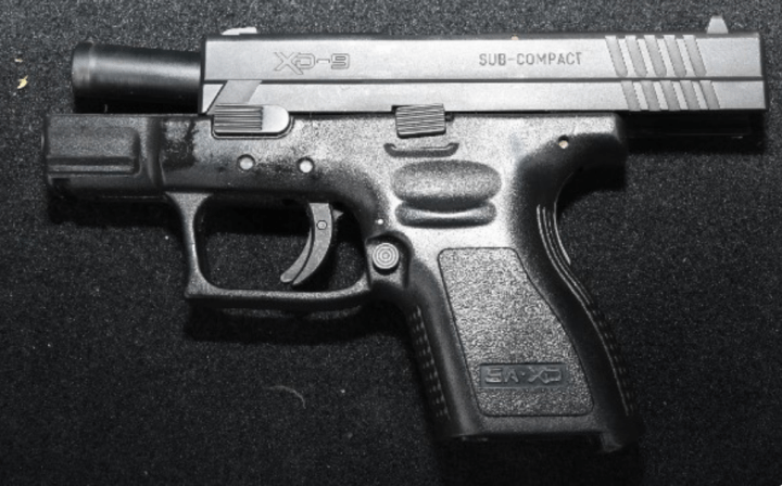 Police say a loaded handgun was among the items seized.
