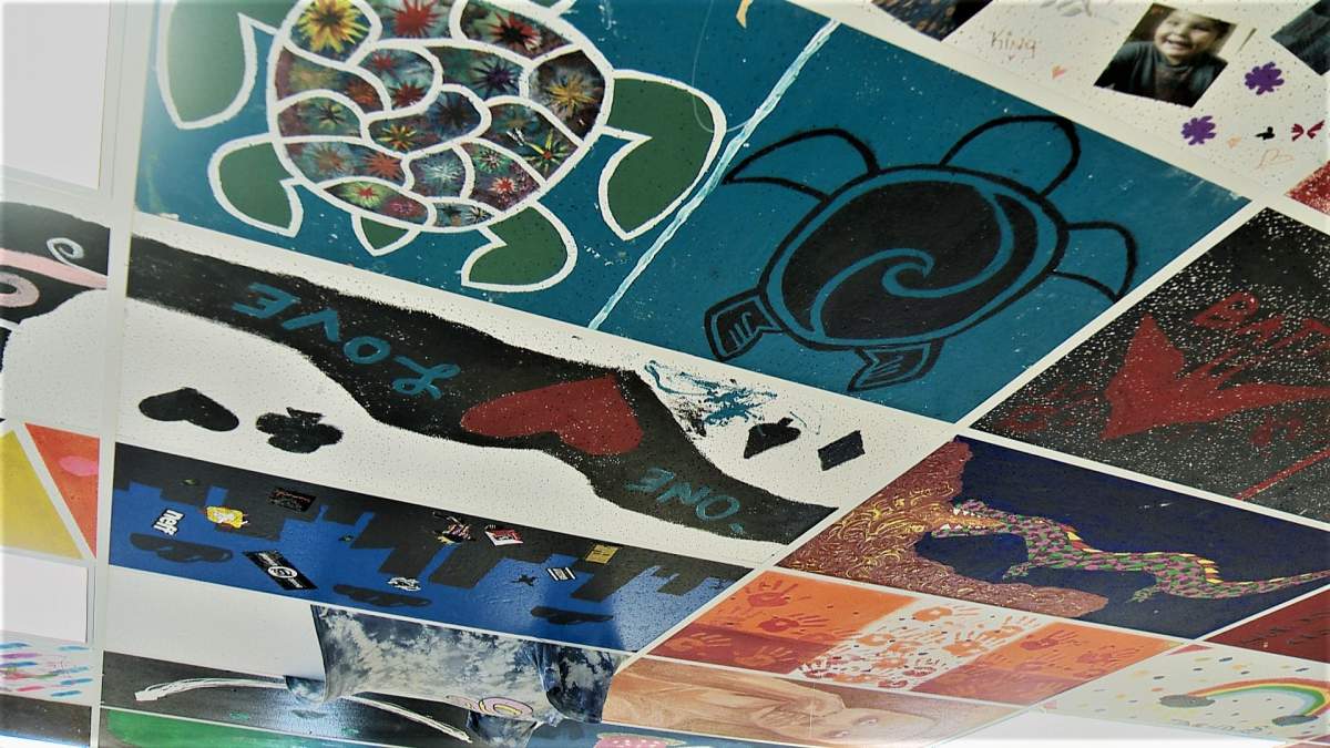 colourful pictures painted on the ceiling by Saskatoon youth.
