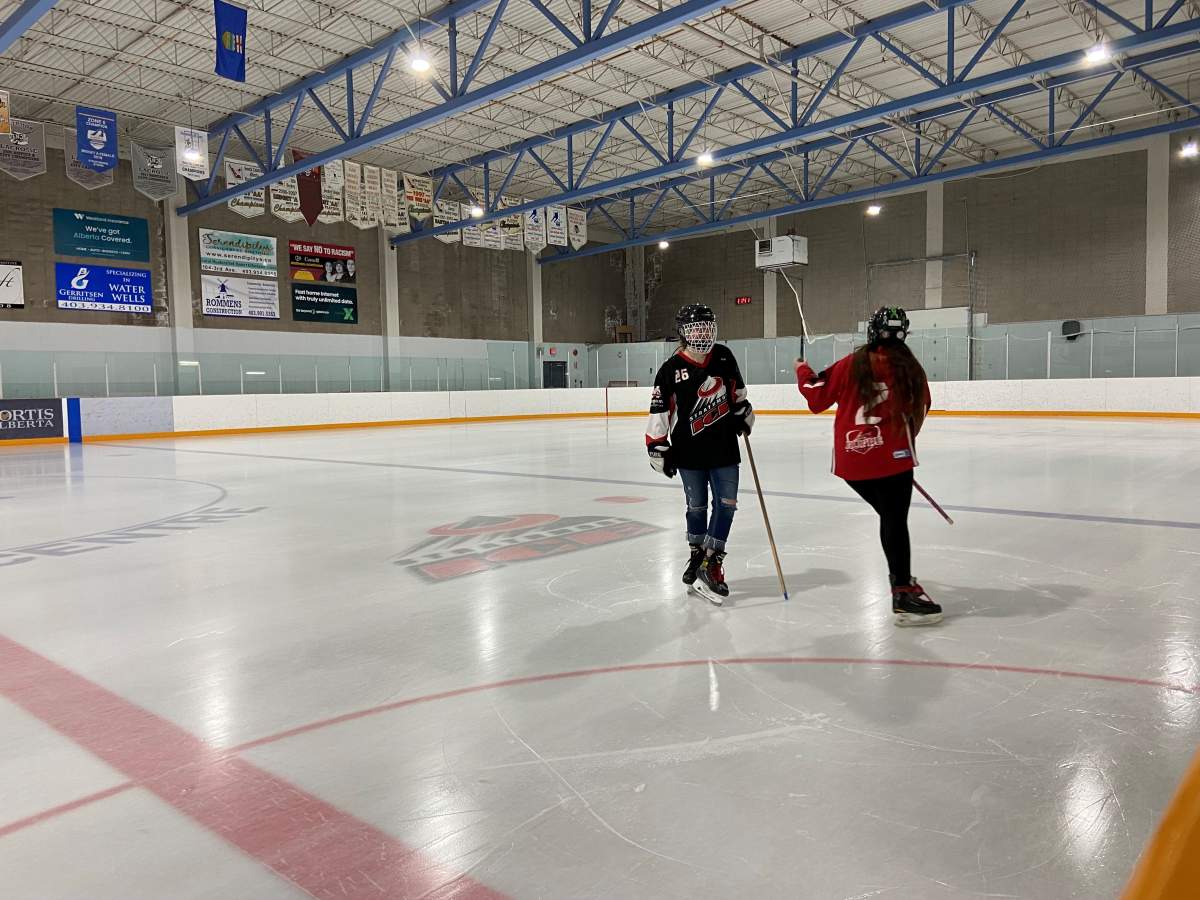 Ringette rink in Town of Strathmore. Katelyn Cumming and Emmarsyn Briggs practice on the ice.
