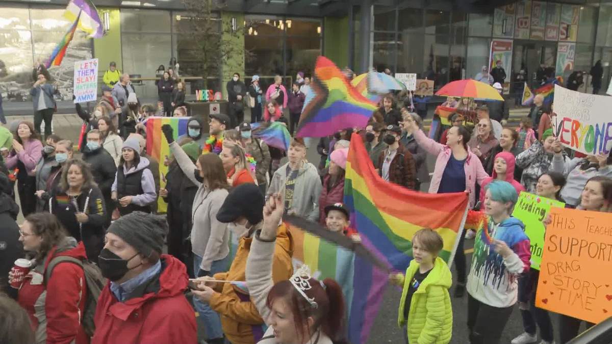 A few hundred people gathered outside of Coquitlam Public Library for a Drag Queen Story Time event.