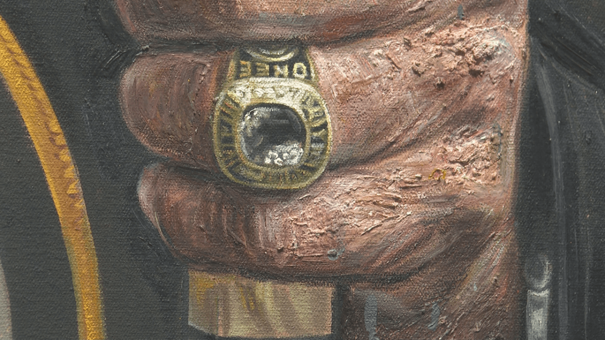 O’Ree was inducted in the Hockey Hall of Fame after the significant efforts of many supporters in Fredericton. His HOF ring is included in the portrait.