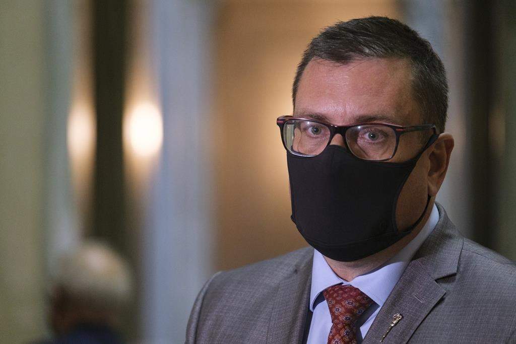 Paul Merriman, Saskatchewan's health minister, speaks to media after the throne speech at the Legislative Building in Regina on Wednesday Oct. 27, 2021.