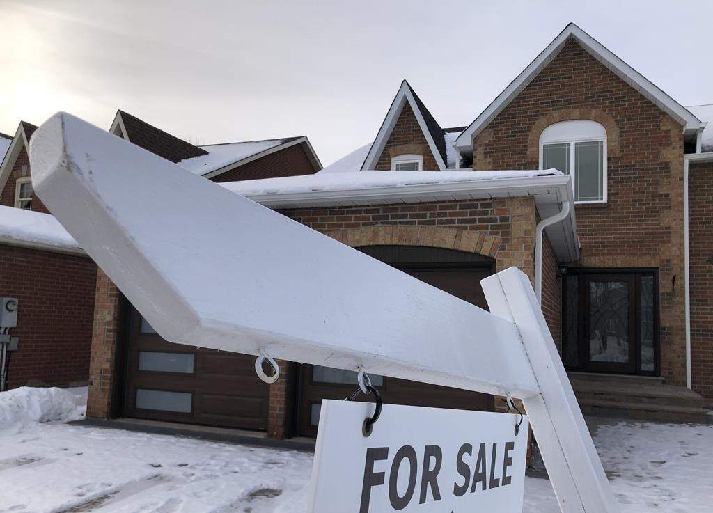 FILE. A house for sale sign