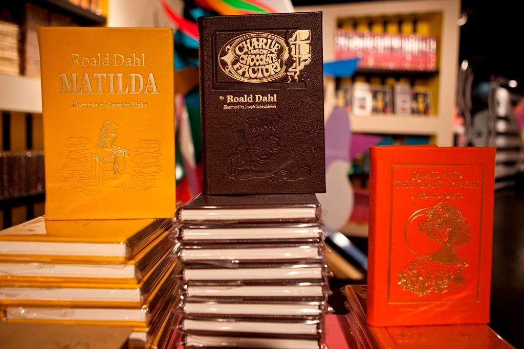 FILE - Books by Roald Dahl are displayed at the Barney's store on East 60th Street in New York on Monday, Nov. 21, 2011. Critics are accusing the publisher of Roald Dahl’s classic children’s books of censorship after it removed colorful language from stories such as “Charlie and the Chocolate Factory” and “Matilda” to make them more acceptable to modern readers.
