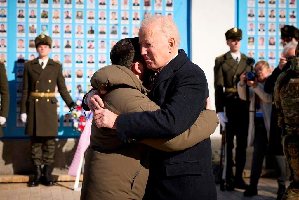 President Joe Biden, right, and Ukrainian President Volodymyr Zelenskyy hug as they say goodbye at the Memorial Wall of Fallen Defenders of Ukraine in Russian-Ukrainian War, in Kyiv, Ukraine, Monday, Feb. 20, 2023. (Ukrainian Presidential Press Office via AP)