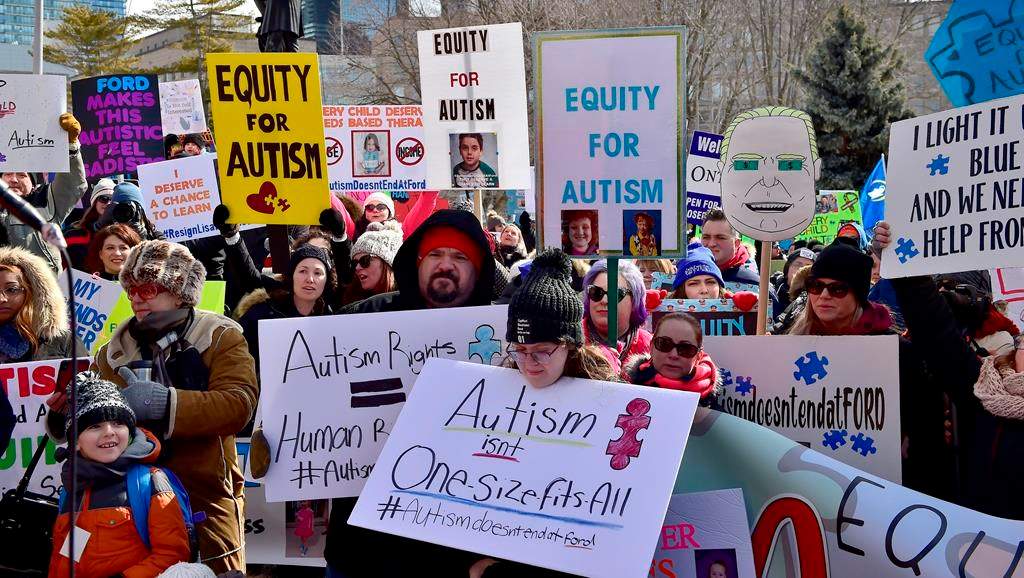 Hundreds of parents, therapists and union members gather outside Queen's Park, in Toronto on Thursday, March 7, 2019, to protest the provincial government's changes to Ontario's autism program. THE CANADIAN PRESS/Frank Gunn.