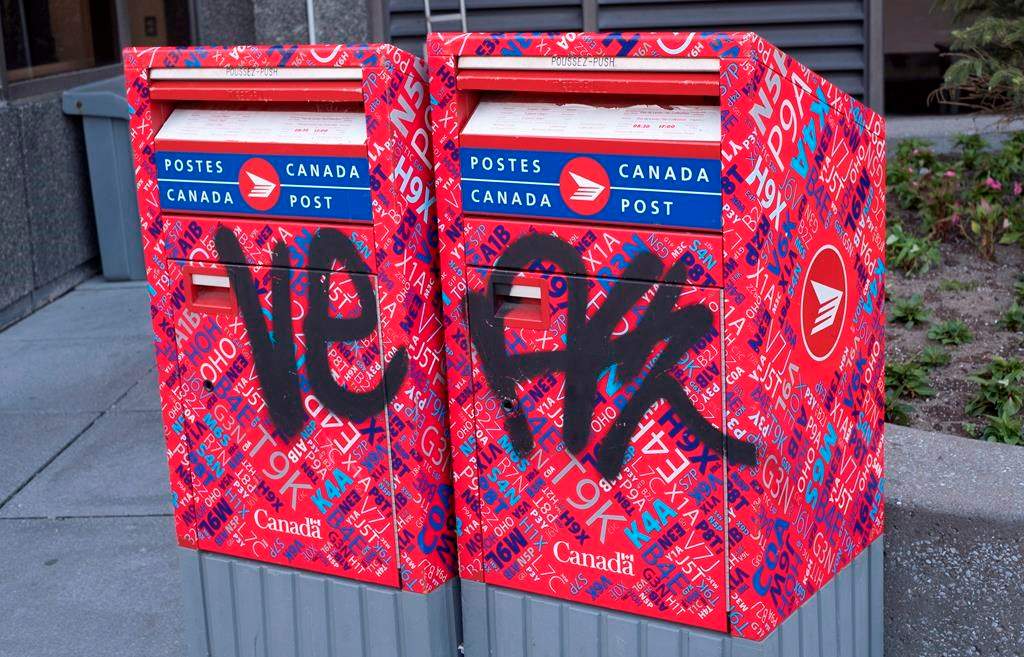Canada Post says a spike in vandalism has put many of its Toronto mailboxes out of commission. A vandalized Canada Post mailbox is seen Tuesday, May 31, 2016 in Montreal. THE CANADIAN PRESS/Paul Chiasson.