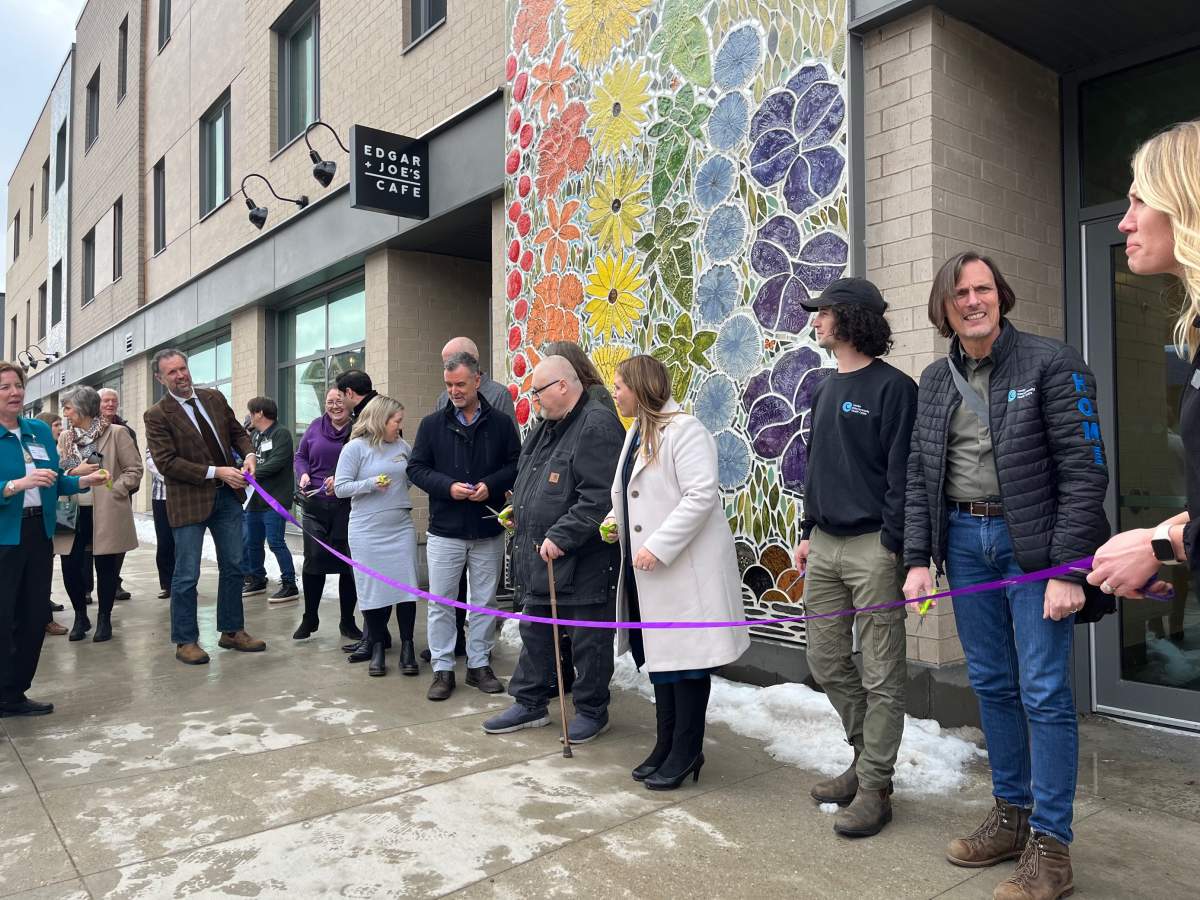 Cutting the rope outside of Embassy Commons in London, Ont. on Feb. 28, 2023.