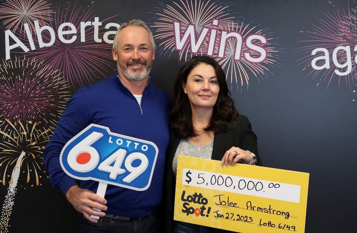 Jolee Armstrong (right) poses for a photo with her husband, Joel Armstrong, after claiming her $5 million win.