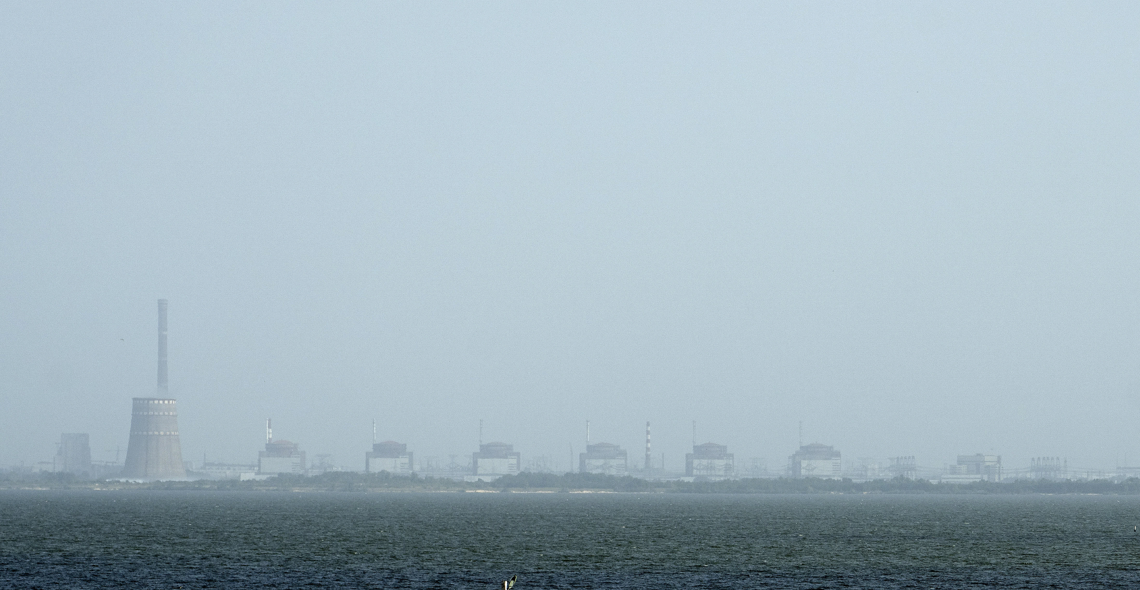 The Zaporizhzhya nuclear plant from Nikopol, Ukraine on Aug, 22, 2022. (AP Photo/Evgeniy Maloletka, File).