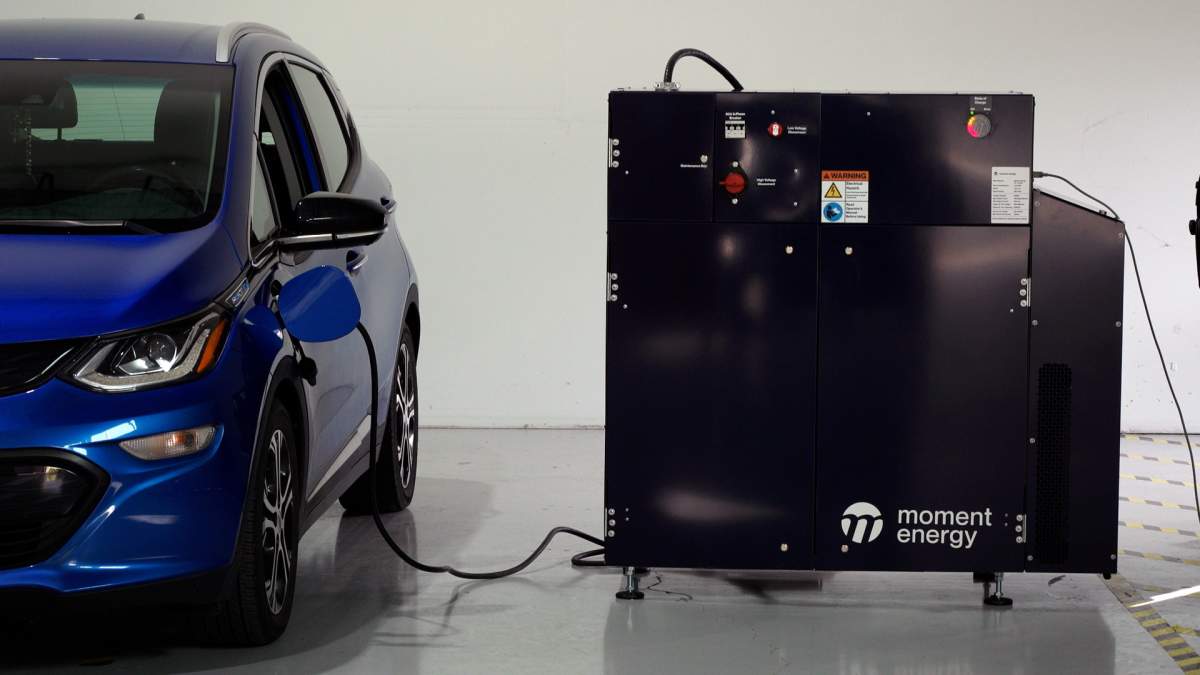 A Chevrolet Volt electric car is charged through Moment Energy's energy storage device.