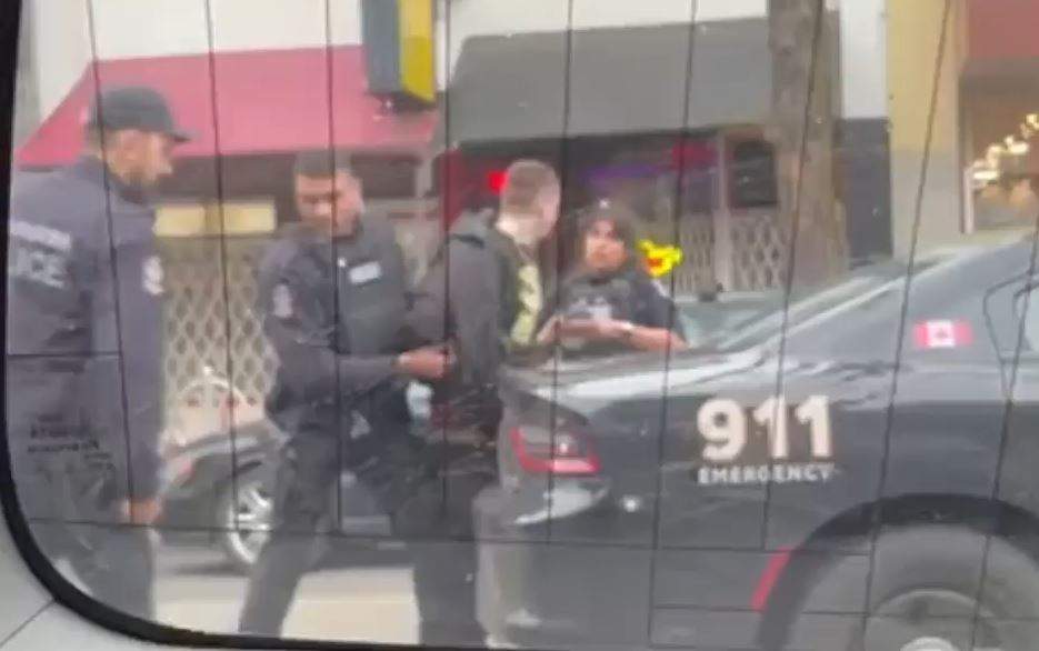 A man is taken into custody following a shooting in Vancouver's Downtown Eastside on Feb. 20. 