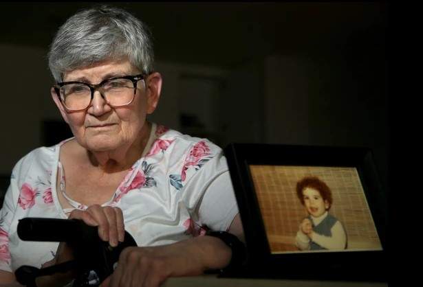 Denise poses with a photo of her missing son Jeffrey Dupres.