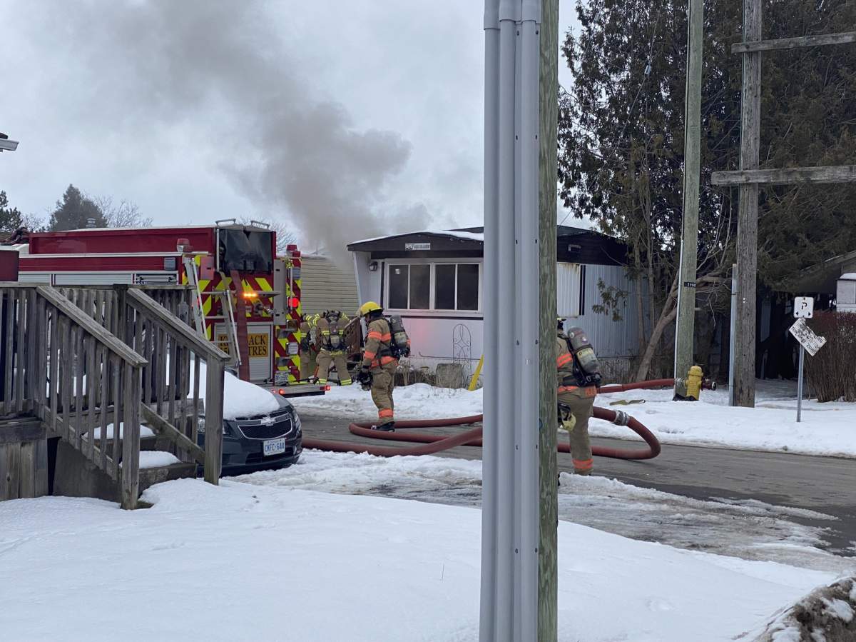 Fire crews were seen battling the blaze at 2189 Dundas Street around 5:15 p.m. on Monday.