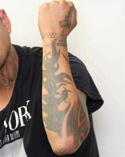Tattoos on the left arm of Edmonton homicide suspect Donn Austin Gauthier.