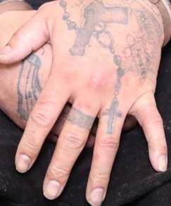 Tattoos on the hand of Edmonton homicide suspect Donn Austin Gauthier.