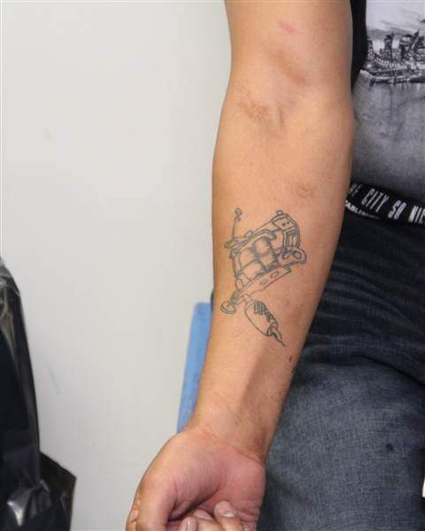Tattoos on the right arm of Edmonton homicide suspect Donn Austin Gauthier.