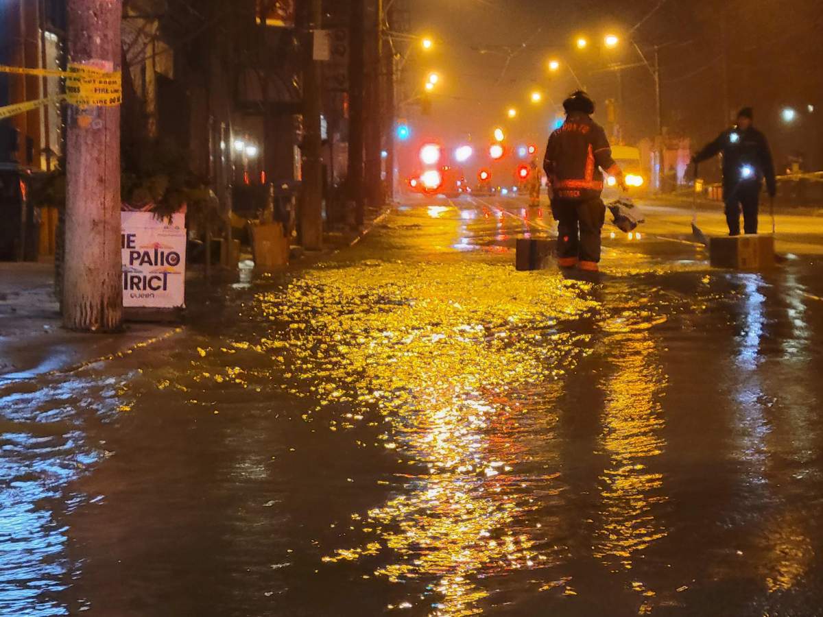 A portion of Queen Street in Toronto is closed after a watermain break.