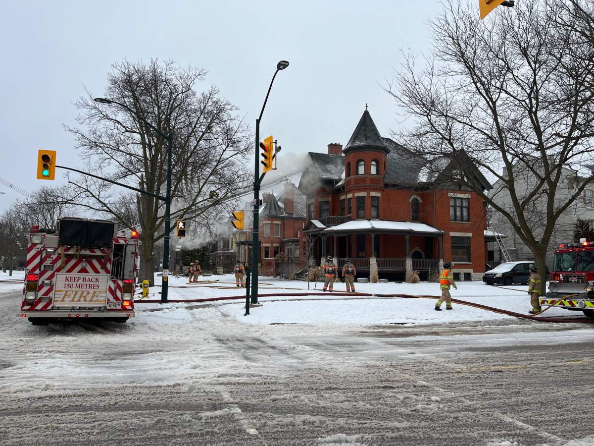 Fire crews battling a blaze at 496 Waterloo Street in London, Ont., on Thursday, Feb. 23, 2023.