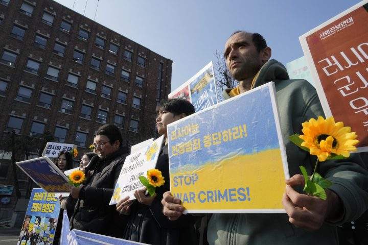 Protesters attend a rally to mark the one-year anniversary of Russia’s invasion of Ukraine, near the Russian Embassy in Seoul, South Korea, Friday, Feb. 24, 2023.