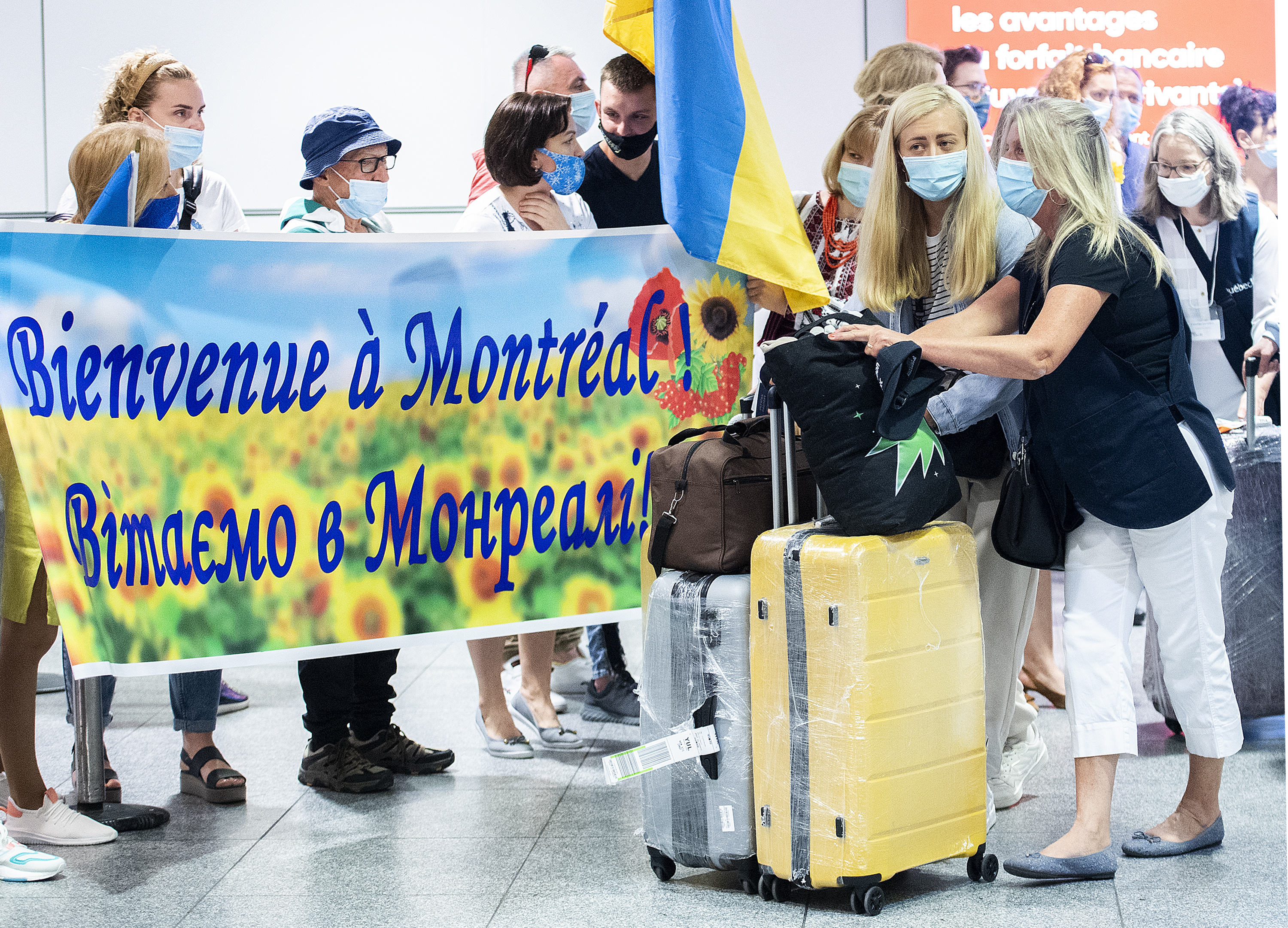 Ukrainians arrive in Montreal to welcome signs.